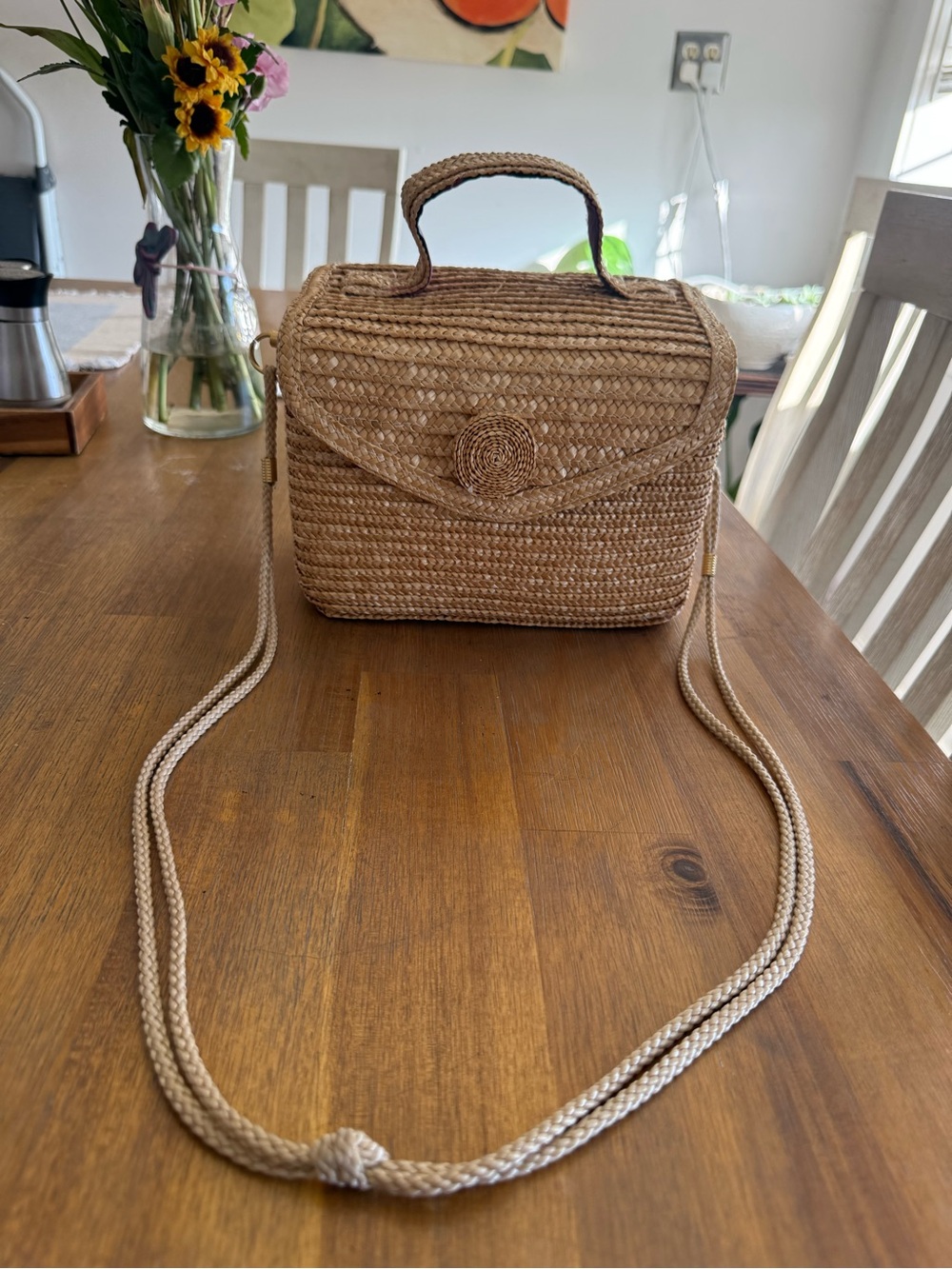 Handmade woven straw bag with a strap